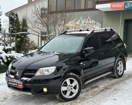 Черный Мицубиси Аутлендер, объемом двигателя 2 л и пробегом 117 тыс. км за 7990 $, фото 1 на Automoto.ua