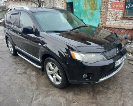 Черный Мицубиси Аутлендер, объемом двигателя 2.42 л и пробегом 270 тыс. км за 7500 $, фото 1 на Automoto.ua