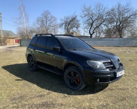 Черный Мицубиси Аутлендер, объемом двигателя 2.4 л и пробегом 325 тыс. км за 6300 $, фото 1 на Automoto.ua