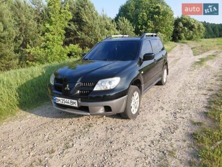 Мицубиси Аутлендер 2008 в Кролевце на Automoto.ua Черный Мицубиси Аутлендер, объемом двигателя 2 л и пробегом 142 тыс. км за 8700 $, фото 1 на Automoto.ua