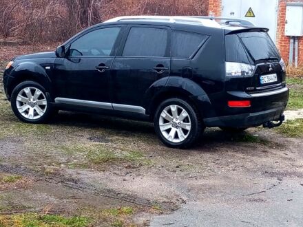 Черный Мицубиси Аутлендер, объемом двигателя 2 л и пробегом 210 тыс. км за 9500 $, фото 1 на Automoto.ua