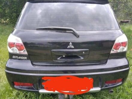 Чорний Міцубісі Аутлендер, об'ємом двигуна 2 л та пробігом 202 тис. км за 5946 $, фото 1 на Automoto.ua