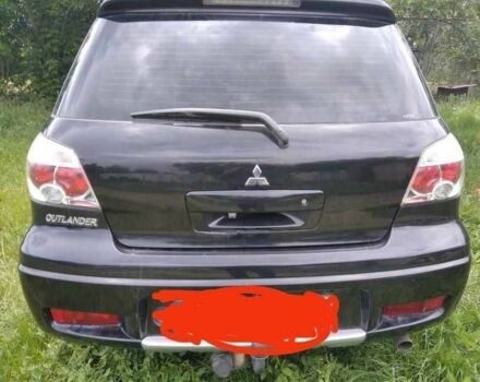 Черный Мицубиси Аутлендер, объемом двигателя 2 л и пробегом 202 тыс. км за 5946 $, фото 1 на Automoto.ua