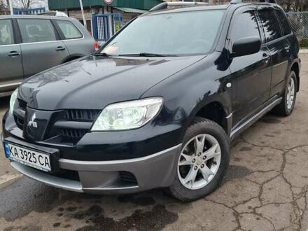Черный Мицубиси Аутлендер, объемом двигателя 2 л и пробегом 212 тыс. км за 7900 $, фото 1 на Automoto.ua