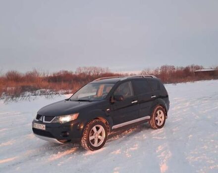 Черный Мицубиси Аутлендер, объемом двигателя 2.36 л и пробегом 220 тыс. км за 8200 $, фото 1 на Automoto.ua