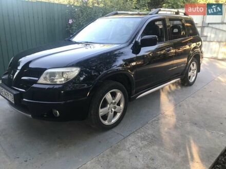 Чорний Міцубісі Аутлендер, об'ємом двигуна 2.38 л та пробігом 207 тис. км за 7000 $, фото 1 на Automoto.ua