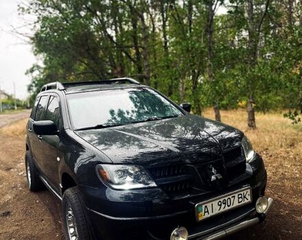 Чорний Міцубісі Аутлендер, об'ємом двигуна 2 л та пробігом 250 тис. км за 6100 $, фото 1 на Automoto.ua