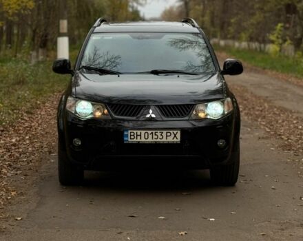 Черный Мицубиси Аутлендер, объемом двигателя 3 л и пробегом 212 тыс. км за 10000 $, фото 1 на Automoto.ua