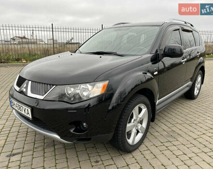 Черный Мицубиси Аутлендер, объемом двигателя 3 л и пробегом 77 тыс. км за 11800 $, фото 1 на Automoto.ua