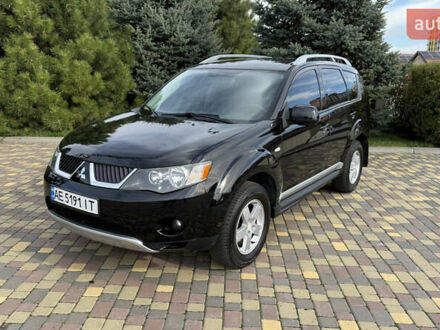 Черный Мицубиси Аутлендер, объемом двигателя 2.4 л и пробегом 295 тыс. км за 8900 $, фото 1 на Automoto.ua