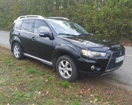 Черный Мицубиси Аутлендер, объемом двигателя 2 л и пробегом 220 тыс. км за 10700 $, фото 1 на Automoto.ua