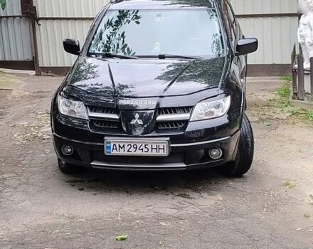 Чорний Міцубісі Аутлендер, об'ємом двигуна 2 л та пробігом 223 тис. км за 7500 $, фото 1 на Automoto.ua