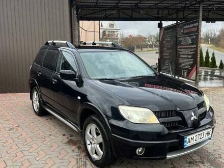 Черный Мицубиси Аутлендер, объемом двигателя 2.38 л и пробегом 220 тыс. км за 7500 $, фото 1 на Automoto.ua