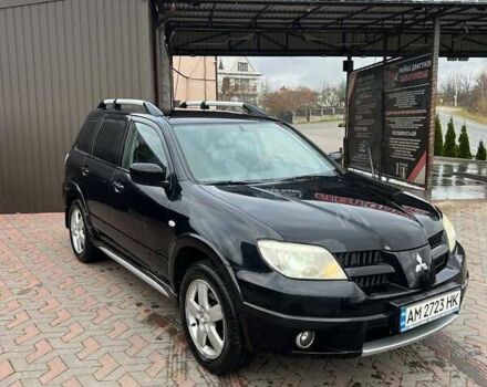 Черный Мицубиси Аутлендер, объемом двигателя 2.38 л и пробегом 220 тыс. км за 7500 $, фото 1 на Automoto.ua