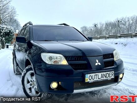 Чорний Міцубісі Аутлендер, об'ємом двигуна 2.4 л та пробігом 150 тис. км за 8100 $, фото 1 на Automoto.ua