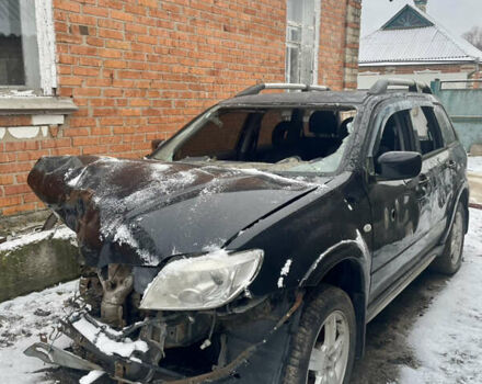 Черный Мицубиси Аутлендер, объемом двигателя 2 л и пробегом 109 тыс. км за 1550 $, фото 1 на Automoto.ua