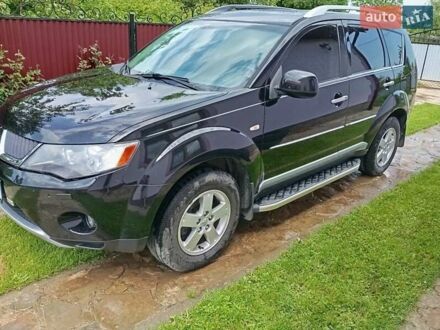 Черный Мицубиси Аутлендер, объемом двигателя 2.2 л и пробегом 279 тыс. км за 11000 $, фото 1 на Automoto.ua