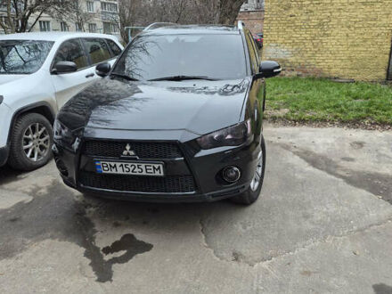 Черный Мицубиси Аутлендер, объемом двигателя 2.4 л и пробегом 198 тыс. км за 10500 $, фото 1 на Automoto.ua