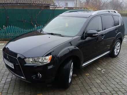 Черный Мицубиси Аутлендер, объемом двигателя 2.2 л и пробегом 225 тыс. км за 11500 $, фото 1 на Automoto.ua