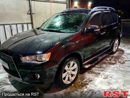 Чорний Міцубісі Аутлендер, об'ємом двигуна 2.4 л та пробігом 70 тис. км за 10500 $, фото 1 на Automoto.ua