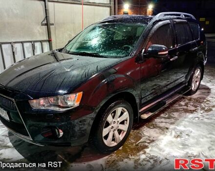 Черный Мицубиси Аутлендер, объемом двигателя 2.4 л и пробегом 70 тыс. км за 10500 $, фото 1 на Automoto.ua