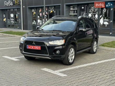 Черный Мицубиси Аутлендер, объемом двигателя 2.2 л и пробегом 225 тыс. км за 10950 $, фото 1 на Automoto.ua
