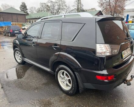 Черный Мицубиси Аутлендер, объемом двигателя 2.4 л и пробегом 305 тыс. км за 10000 $, фото 1 на Automoto.ua