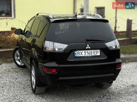 Черный Мицубиси Аутлендер, объемом двигателя 2.4 л и пробегом 184 тыс. км за 10800 $, фото 1 на Automoto.ua