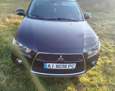 Черный Мицубиси Аутлендер, объемом двигателя 2 л и пробегом 261 тыс. км за 9700 $, фото 1 на Automoto.ua