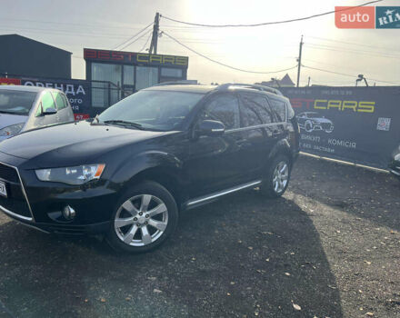 Черный Мицубиси Аутлендер, объемом двигателя 2.36 л и пробегом 244 тыс. км за 9850 $, фото 1 на Automoto.ua