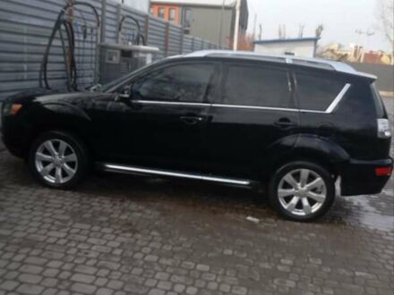 Черный Мицубиси Аутлендер, объемом двигателя 2.2 л и пробегом 264 тыс. км за 10700 $, фото 1 на Automoto.ua