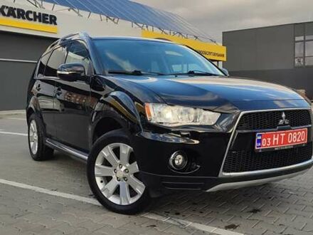 Черный Мицубиси Аутлендер, объемом двигателя 2 л и пробегом 210 тыс. км за 10600 $, фото 1 на Automoto.ua
