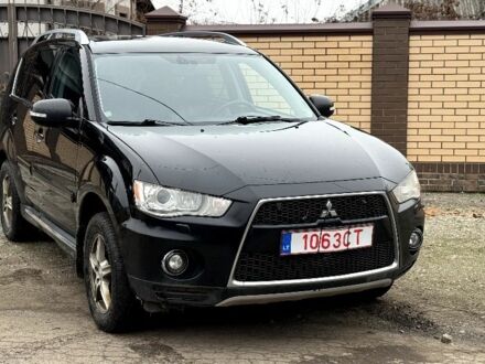 Чорний Міцубісі Аутлендер, об'ємом двигуна 2 л та пробігом 300 тис. км за 5500 $, фото 1 на Automoto.ua