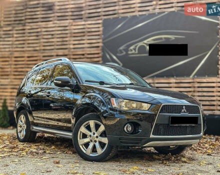 Черный Мицубиси Аутлендер, объемом двигателя 2.2 л и пробегом 226 тыс. км за 11500 $, фото 1 на Automoto.ua