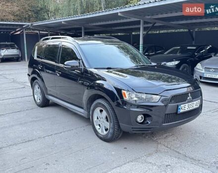 Черный Мицубиси Аутлендер, объемом двигателя 2 л и пробегом 150 тыс. км за 10200 $, фото 1 на Automoto.ua