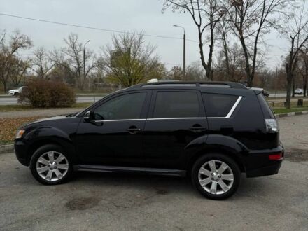 Черный Мицубиси Аутлендер, объемом двигателя 2.2 л и пробегом 253 тыс. км за 12500 $, фото 1 на Automoto.ua