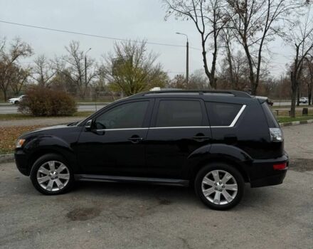 Черный Мицубиси Аутлендер, объемом двигателя 2.2 л и пробегом 253 тыс. км за 12500 $, фото 1 на Automoto.ua