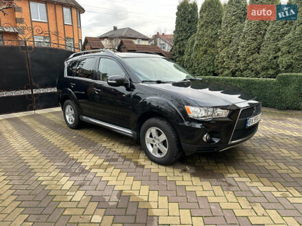 Черный Мицубиси Аутлендер, объемом двигателя 2.2 л и пробегом 216 тыс. км за 12000 $, фото 1 на Automoto.ua