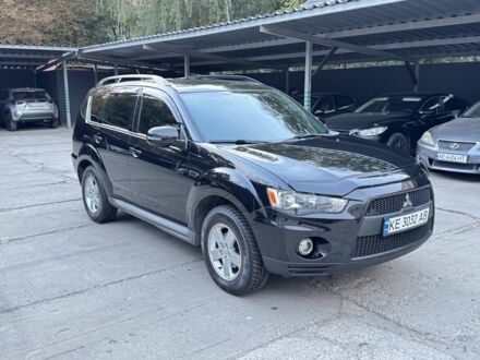 Черный Мицубиси Аутлендер, объемом двигателя 2 л и пробегом 150 тыс. км за 10200 $, фото 1 на Automoto.ua