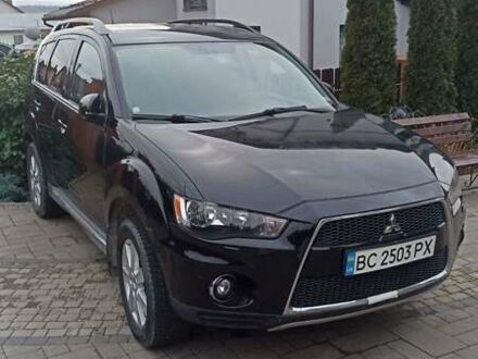 Черный Мицубиси Аутлендер, объемом двигателя 2 л и пробегом 196 тыс. км за 9900 $, фото 1 на Automoto.ua