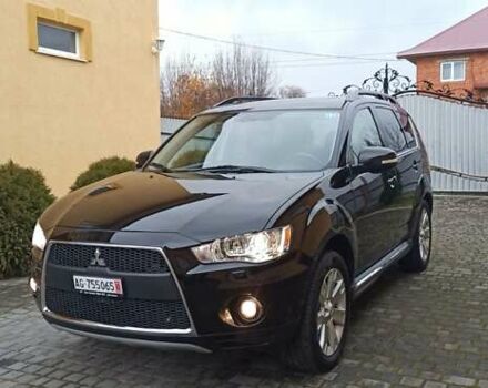 Черный Мицубиси Аутлендер, объемом двигателя 2.2 л и пробегом 209 тыс. км за 12700 $, фото 1 на Automoto.ua