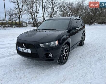 Черный Мицубиси Аутлендер, объемом двигателя 2.4 л и пробегом 177 тыс. км за 10300 $, фото 1 на Automoto.ua