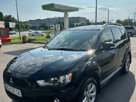 Черный Мицубиси Аутлендер, объемом двигателя 2.36 л и пробегом 172 тыс. км за 11000 $, фото 1 на Automoto.ua