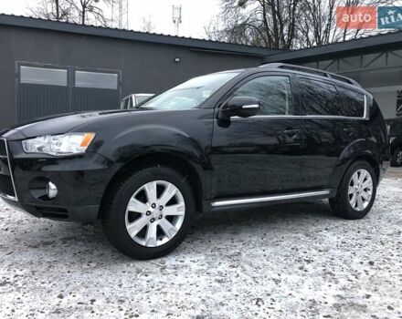 Черный Мицубиси Аутлендер, объемом двигателя 2 л и пробегом 195 тыс. км за 10100 $, фото 1 на Automoto.ua