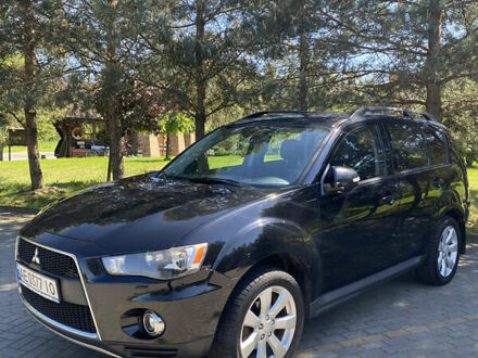 Черный Мицубиси Аутлендер, объемом двигателя 2.36 л и пробегом 155 тыс. км за 9000 $, фото 1 на Automoto.ua