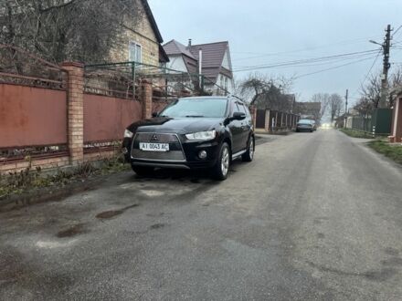 Черный Мицубиси Аутлендер, объемом двигателя 2.4 л и пробегом 136 тыс. км за 14500 $, фото 1 на Automoto.ua