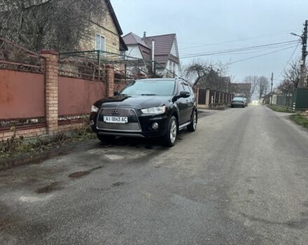 Черный Мицубиси Аутлендер, объемом двигателя 2.4 л и пробегом 136 тыс. км за 14500 $, фото 1 на Automoto.ua