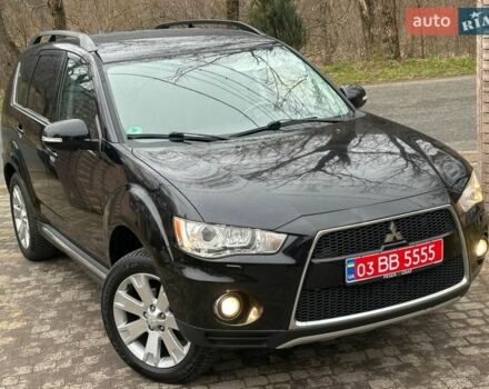 Черный Мицубиси Аутлендер, объемом двигателя 2.3 л и пробегом 225 тыс. км за 10899 $, фото 1 на Automoto.ua