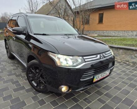 Черный Мицубиси Аутлендер, объемом двигателя 2.36 л и пробегом 211 тыс. км за 12590 $, фото 1 на Automoto.ua
