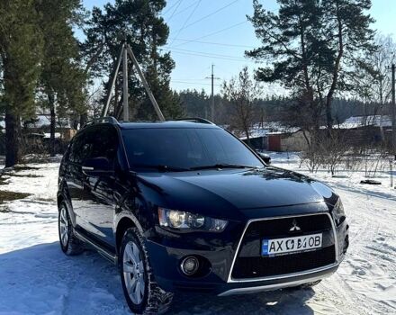 Черный Мицубиси Аутлендер, объемом двигателя 2 л и пробегом 14800 тыс. км за 7600 $, фото 1 на Automoto.ua